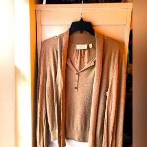 Anthropologie tan sweater with a tie neck.